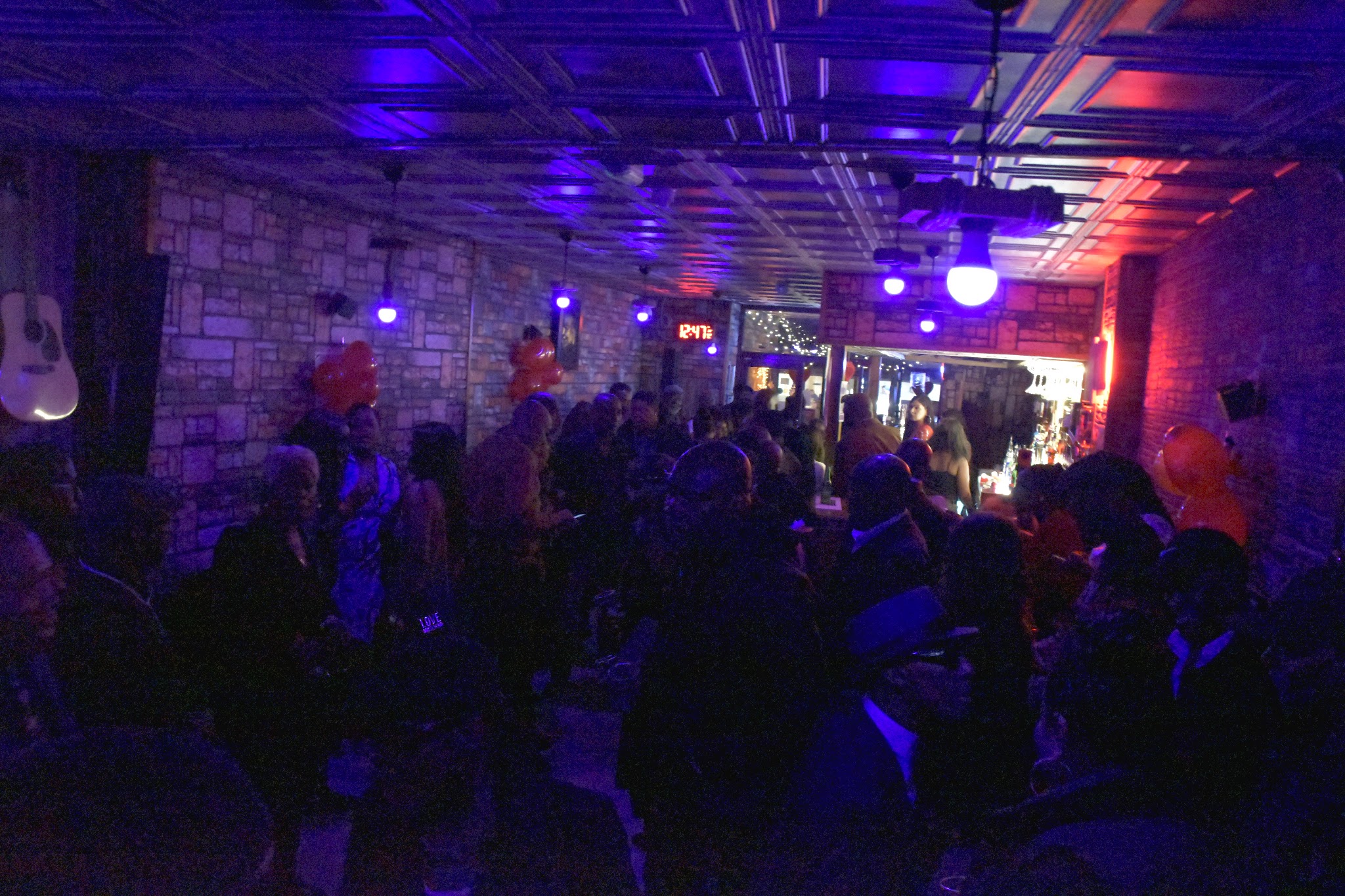 The Marmalade Club main room packed under blue and red lighting.